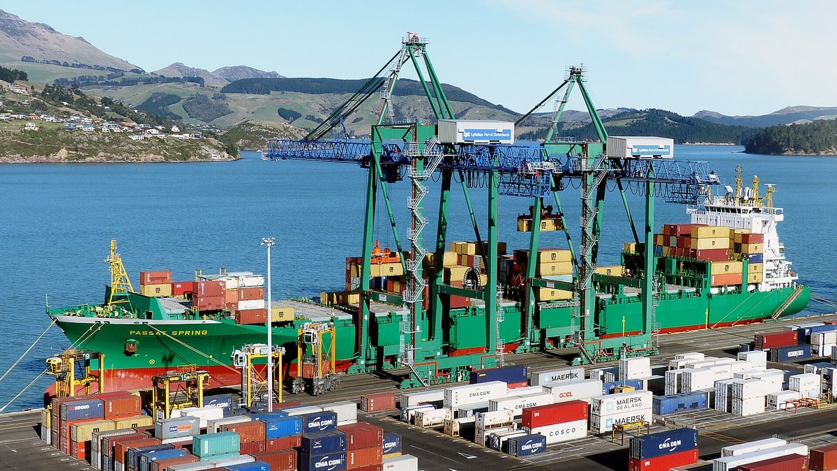 Container ship loading at a port terminal for sea freight delivery planning